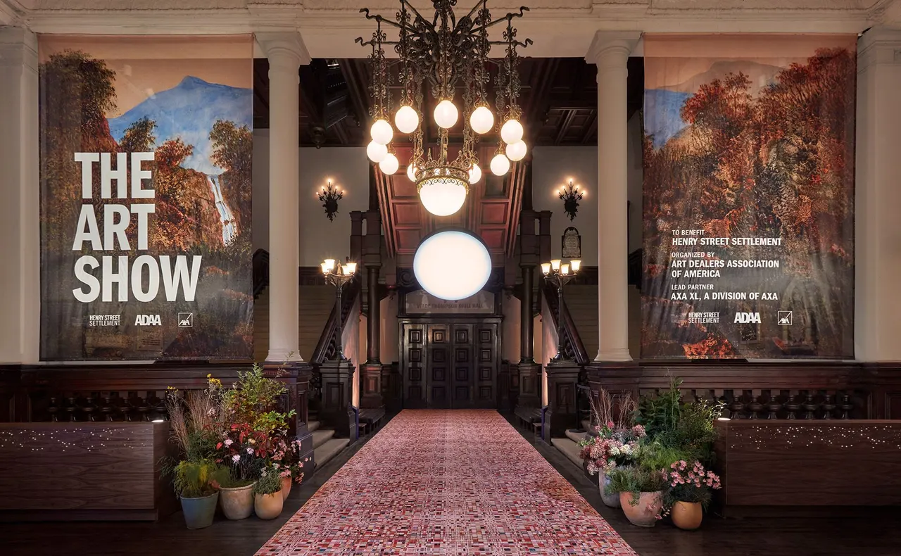 Entrance to The Art Show 2023 at the Park Avenue Armory, photo by Jason Wyche. On scrims: George Sand, Waterfall with Mountain in Distance, 1875, courtesy Jill Newhouse Gallery. Lighting by Zumtobel.